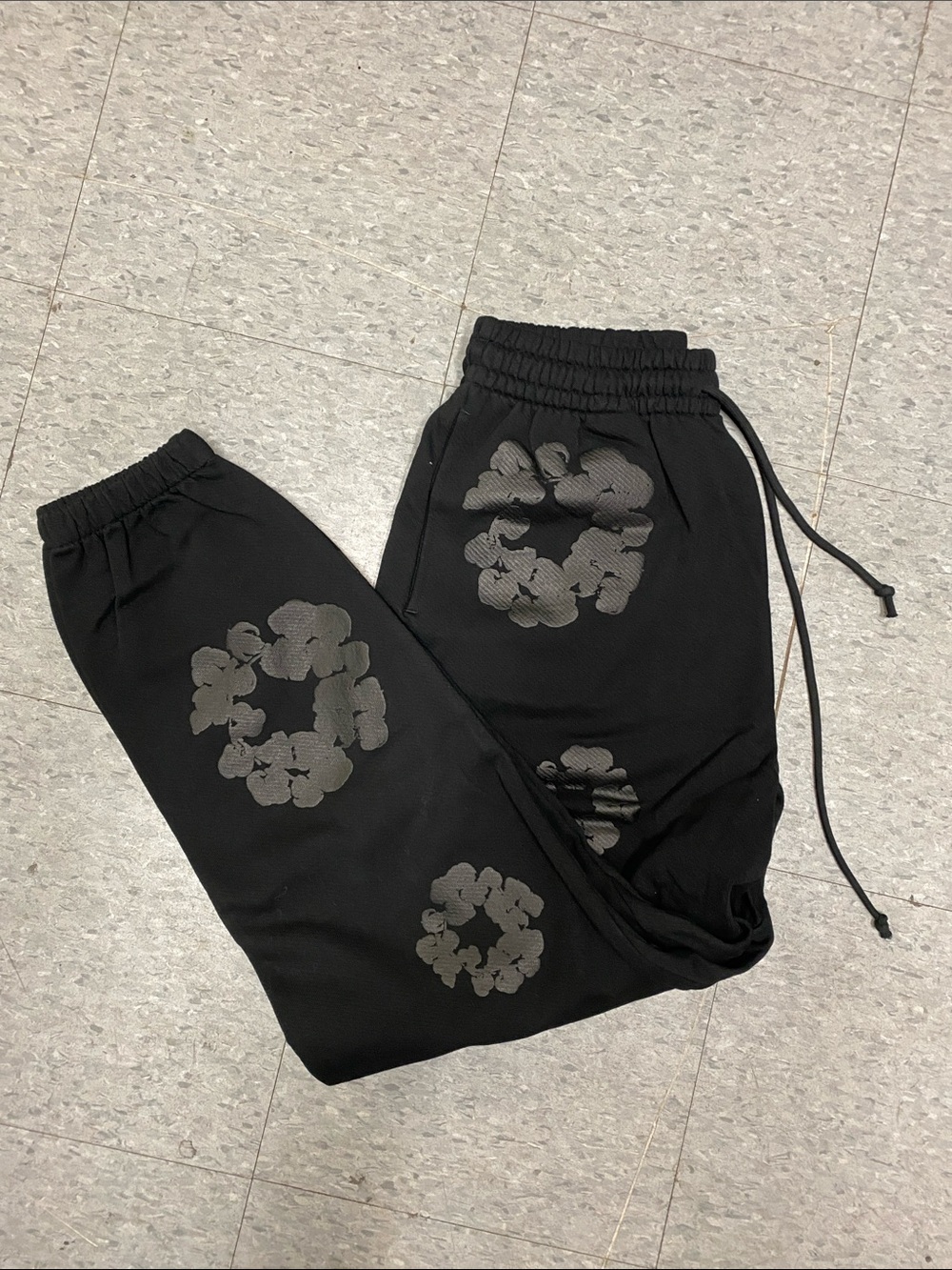 Denim Tears Black Jogger Sweatpants with Gray Floral Prints